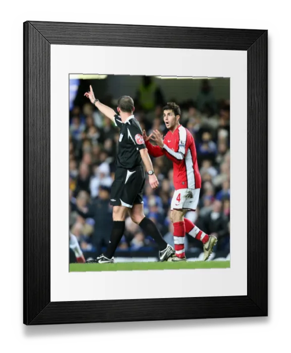 Framed Print : Cesc Fabregas (Arsenal) and Referee Mike Dean Framed Print : Cesc Fabregas (Arsenal) and Referee Mike Dean