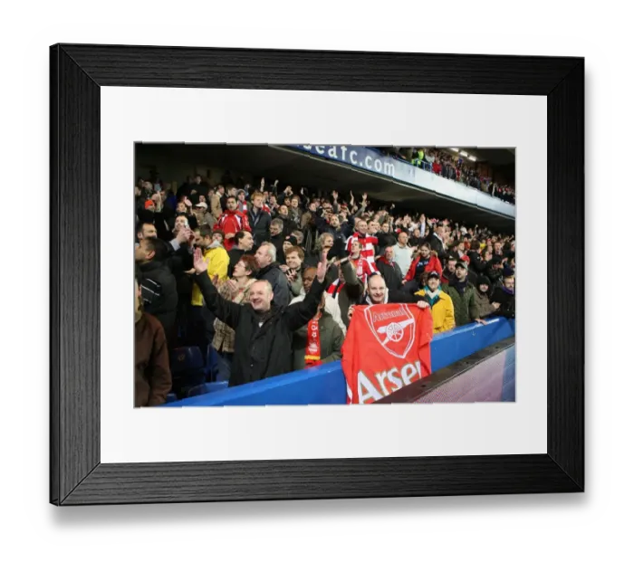Framed Print : Arsenal fans celebrate at the end of the match Framed Print : Arsenal fans celebrate at the end of the match