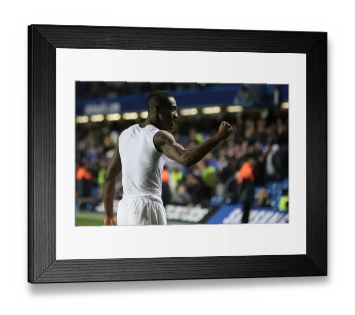 Framed Print : Arsenal defender Johan Djourou celebrates after the match Framed Print : Arsenal defender Johan Djourou celebrates after the match