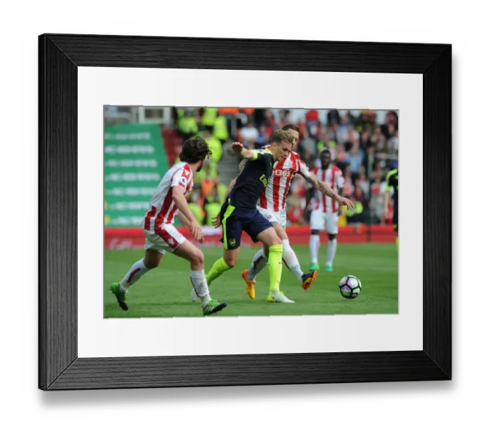 Framed Print : Rob Holding (Arsenal) Marko Arnautovic (Stoke). Stoke City 1: 4 Arsenal. Premier League