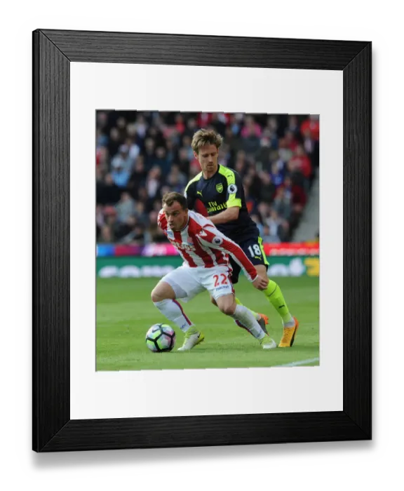Framed Print : Monreal vs Shaqiri: Intense Battle in Stoke City vs Arsenal Premier League Clash