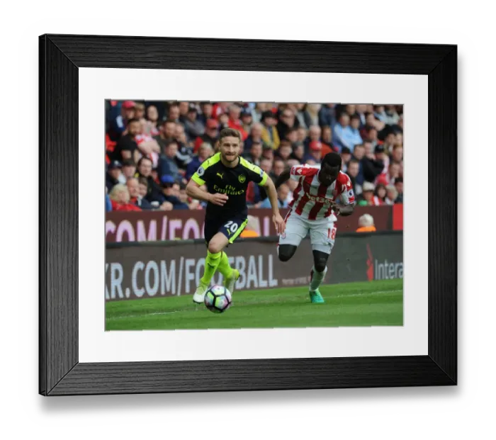 Framed Print : Mustafi vs. Diouf: Intense Clash Between Stoke and Arsenal in Premier League Framed Print : Mustafi vs. Diouf: Intense Clash Between Stoke and Arsenal in Premier League