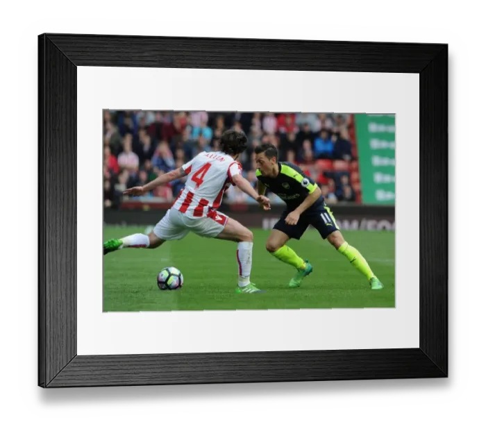 Framed Print : Mesut Ozil vs. Joe Allen: Clash of Midfield Titans - Stoke City vs. Arsenal, Premier League 2016-17