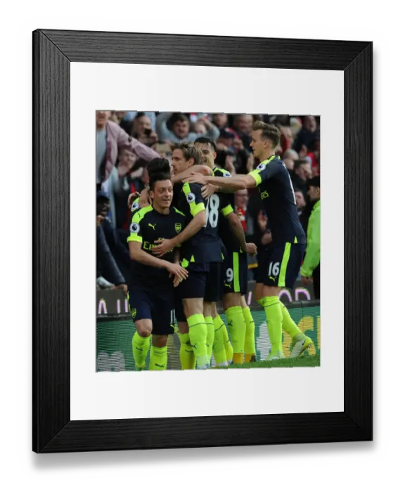 Framed Print : Mesut Ozil, Monreal, Xhaka, and Holding Celebrate Arsenal's Goals Against Stoke City Framed Print : Mesut Ozil, Monreal, Xhaka, and Holding Celebrate Arsenal's Goals Against Stoke City