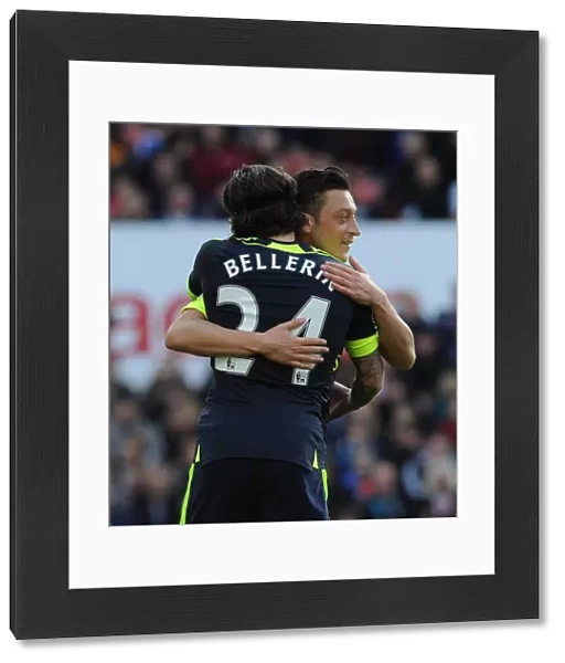 Arsenal's Unstoppable Duo: Ozil and Bellerin Celebrate Goal Against Stoke City