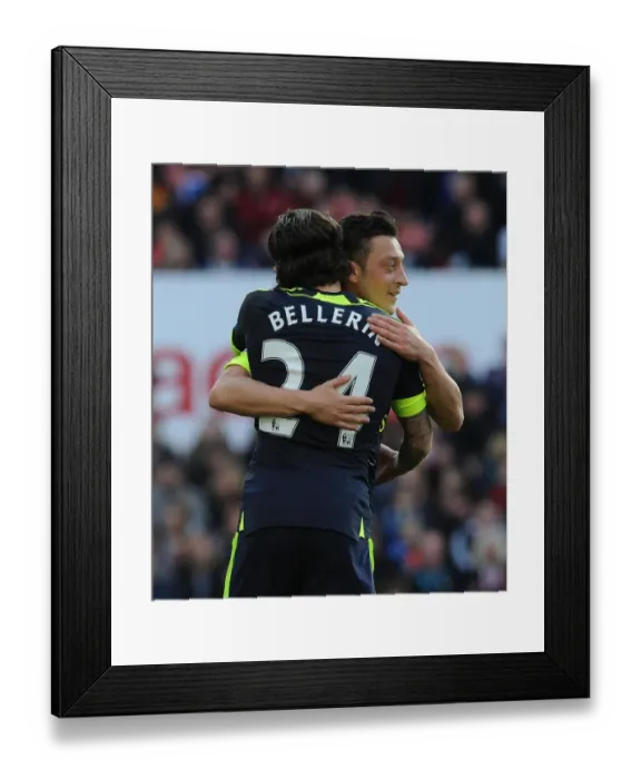 Framed Print : Arsenal's Unstoppable Duo: Ozil and Bellerin Celebrate Goal Against Stoke City
