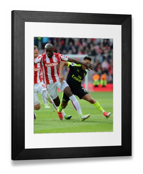 Framed Print : Clash of Forces: Sanchez vs. Martins Indi - Arsenal vs. Stoke City Framed Print : Clash of Forces: Sanchez vs. Martins Indi - Arsenal vs. Stoke City