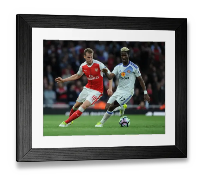 Framed Print : Arsenal's Rob Holding Clashes with Sunderland's Didier Ndong in Premier League Showdown Framed Print : Arsenal's Rob Holding Clashes with Sunderland's Didier Ndong in Premier League Showdown