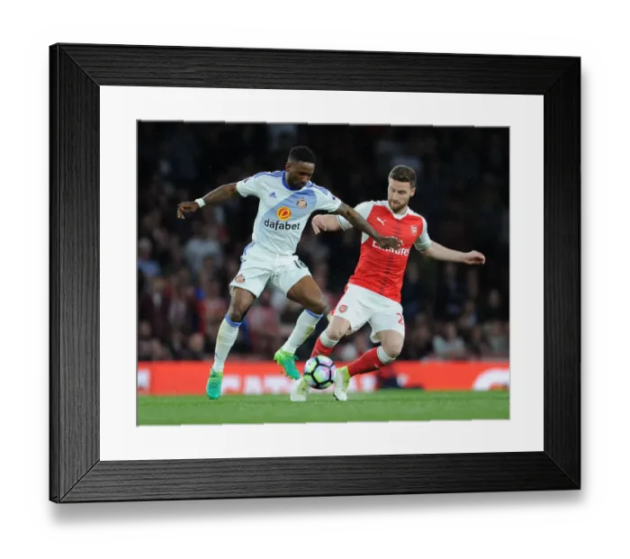 Framed Print : Mustafi vs Defoe: Intense Clash in Arsenal's Victory over Sunderland (2016-17)