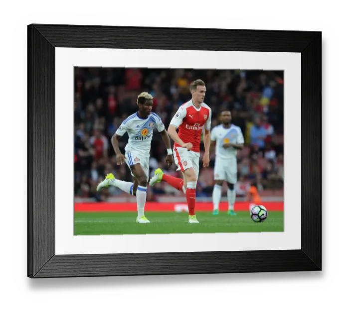Framed Print : Rob Holding Surges Past Didier Ndong: Arsenal vs Sunderland, Premier League 2016-17