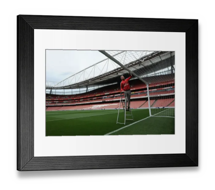 Framed Print : Arsenal's Groundsman Prepares Emirates Stadium for Arsenal v Sunderland Match Framed Print : Arsenal's Groundsman Prepares Emirates Stadium for Arsenal v Sunderland Match