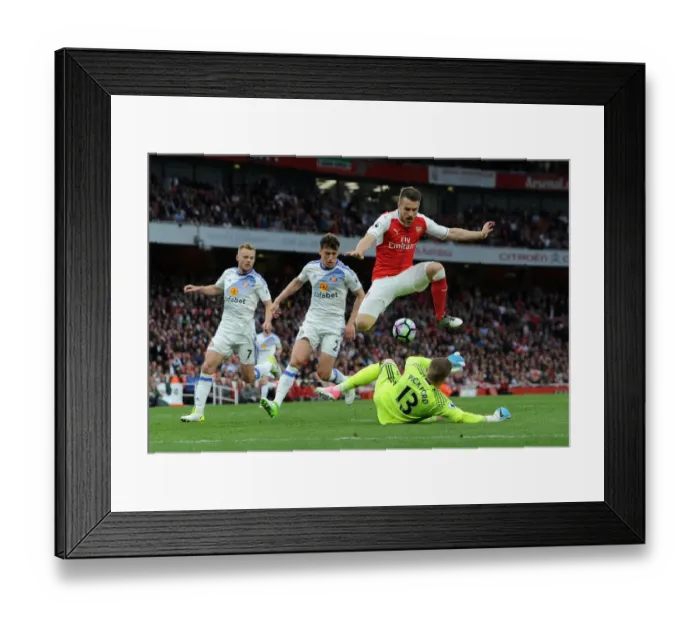 Framed Print : Arsenal's Aaron Ramsey Leaps Over Sunderland's Jordan Pickford