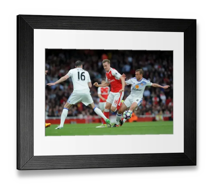 Framed Print : Arsenal vs Sunderland: Rob Holding Stands Firm Against John O'Shea and Lee Catermole