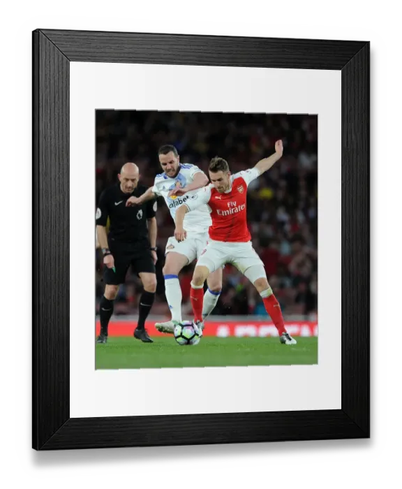 Framed Print : Arsenal's Aaron Ramsey Clashes with Sunderland's John O'Shea during Premier League Match