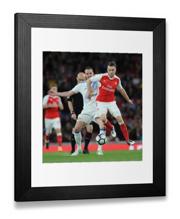 Framed Print : Arsenal's Aaron Ramsey Faces Off Against Sunderland's John O'Shea in Premier League Showdown Framed Print : Arsenal's Aaron Ramsey Faces Off Against Sunderland's John O'Shea in Premier League Showdown