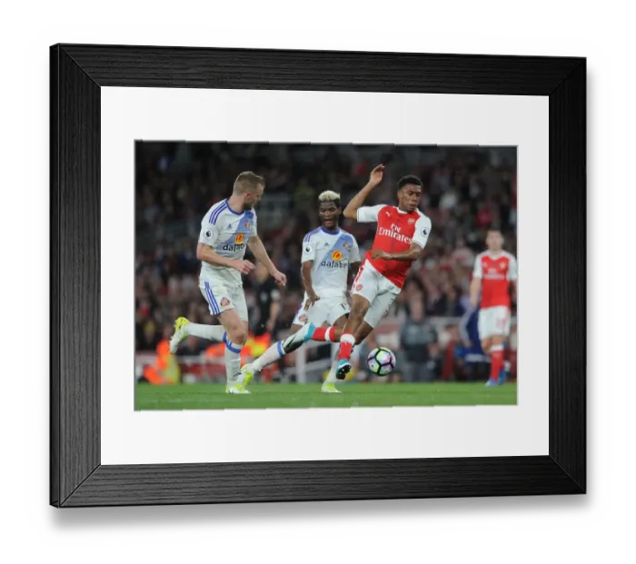Framed Print : Arsenal's Alex Iwobi Fouled by Sunderland's Didier Ndong during Premier League Match Framed Print : Arsenal's Alex Iwobi Fouled by Sunderland's Didier Ndong during Premier League Match