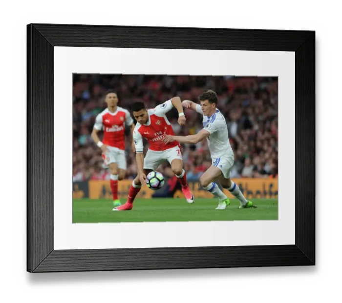Framed Print : Intense Face-Off: Alexis Sanchez vs. Billy Jones in Premier League Showdown