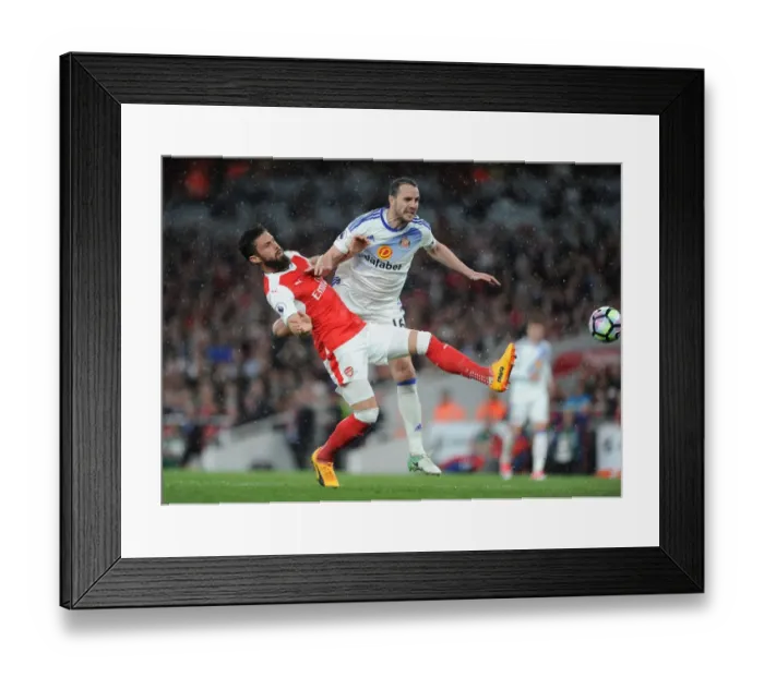 Framed Print : Giroud vs. O'Shea: Intense Battle at the Emirates - Arsenal v Sunderland, Premier League 2016-17