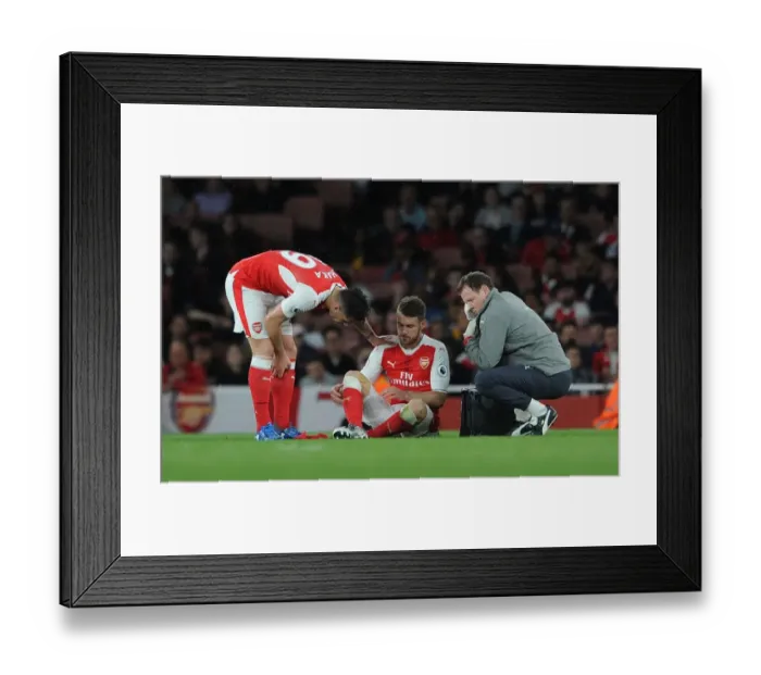 Framed Print : Arsenal's Ramsey and Xhaka Consulting Team Physio Lewin During Arsenal v Sunderland Match