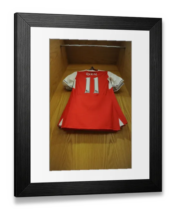 Framed Print : Mesut Ozil's Arsenal Shirt in Arsenal Changing Room Before Arsenal vs. Everton (2016-17)