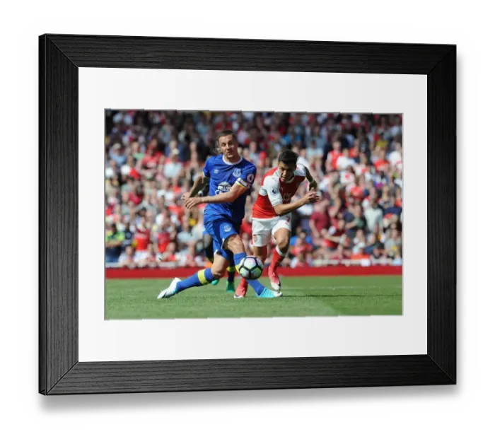 Framed Print : Intense Clash: Phil Jagielka Fouls Alexis Sanchez (Arsenal vs. Everton, 2016-17)