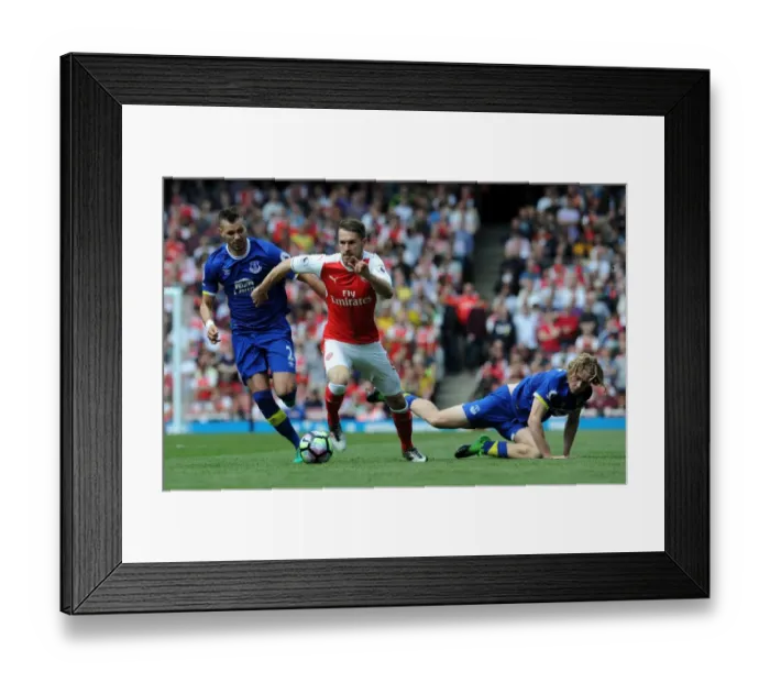 Framed Print : Arsenal's Ramsey Tangles with Everton's Jagielka and Davies in Intense Premier League Clash