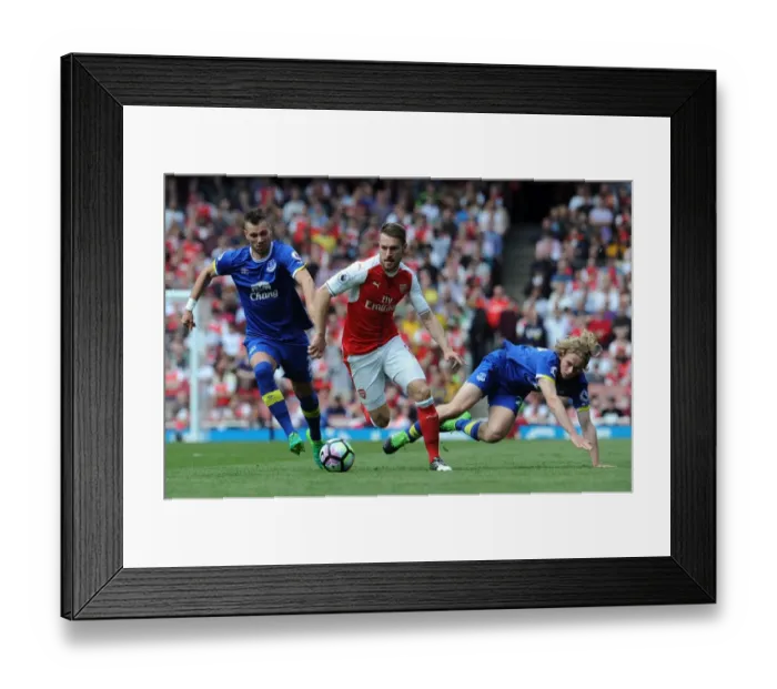Framed Print : Arsenal's Ramsey Battles Everton's Jagielka and Davies in Premier League Clash Framed Print : Arsenal's Ramsey Battles Everton's Jagielka and Davies in Premier League Clash