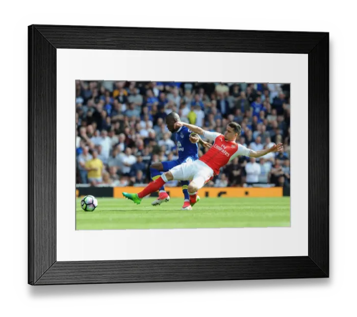 Framed Print : Arsenal's Gabriel Faces Off Against Everton's Enner Valencia in Intense Premier League Clash Framed Print : Arsenal's Gabriel Faces Off Against Everton's Enner Valencia in Intense Premier League Clash