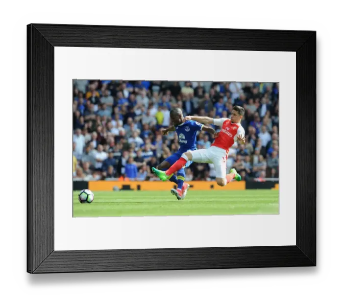 Framed Print : Gabriel vs. Valencia: A Premier League Showdown at the Emirates Framed Print : Gabriel vs. Valencia: A Premier League Showdown at the Emirates
