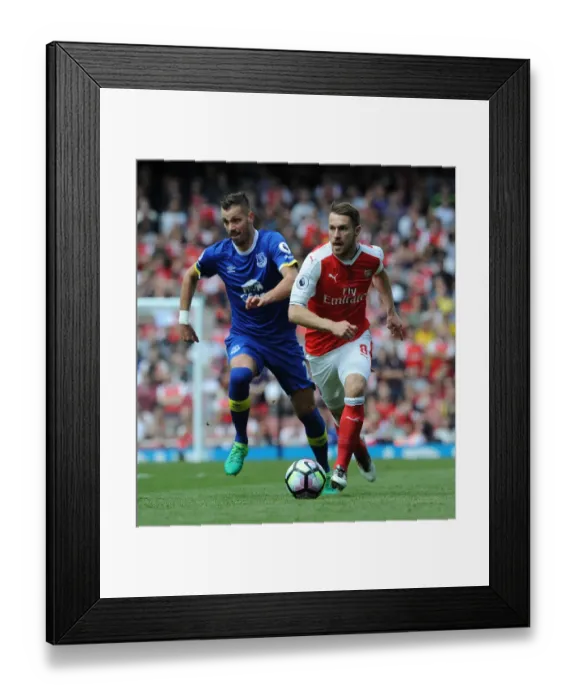 Framed Print : Arsenal's Ramsey Tangles with Everton's Schneiderlin in Premier League Clash Framed Print : Arsenal's Ramsey Tangles with Everton's Schneiderlin in Premier League Clash