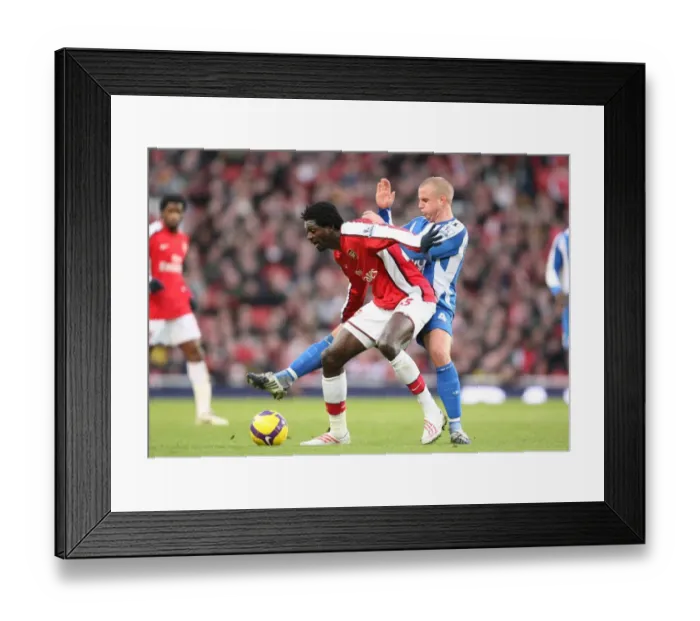 Framed Print : Emmanual Adebayor (Arsenal) Lee Cattermole (Wigan) Framed Print : Emmanual Adebayor (Arsenal) Lee Cattermole (Wigan)