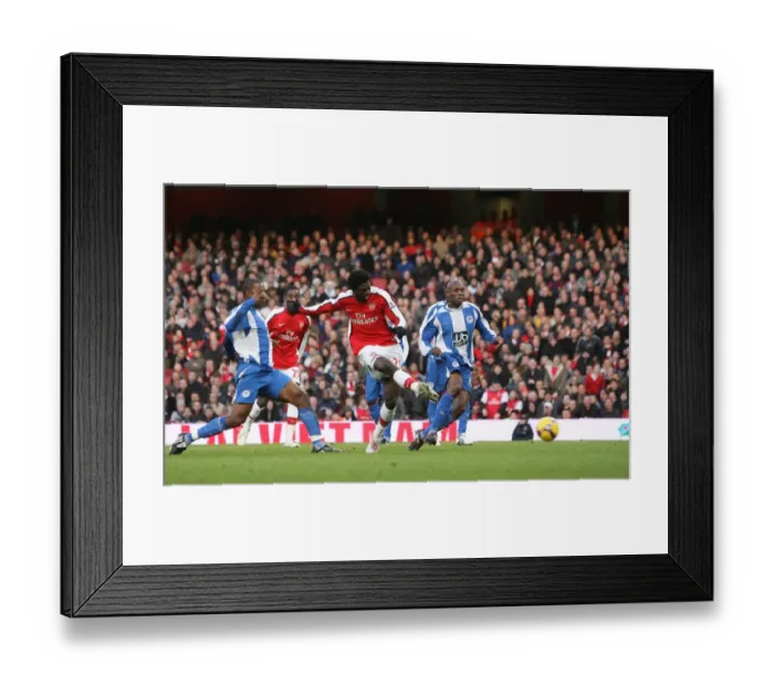 Framed Print : Adebayor Scores Stunner: Arsenal Lead Wigan 1-0 Framed Print : Adebayor Scores Stunner: Arsenal Lead Wigan 1-0