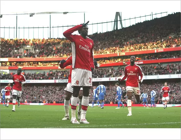 Emmanual Adebayor celebrates scoring the Arsenal goal