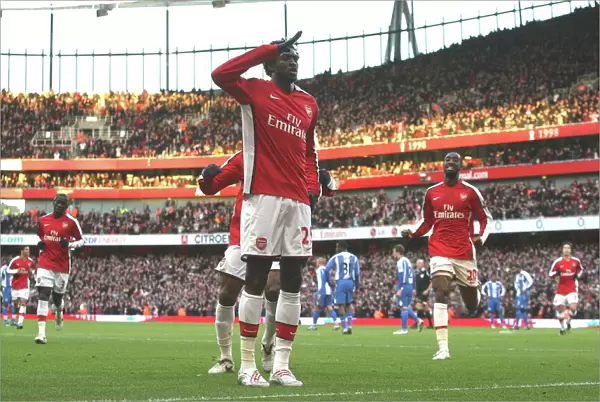 Emmanual Adebayor celebrates scoring the Arsenal goal