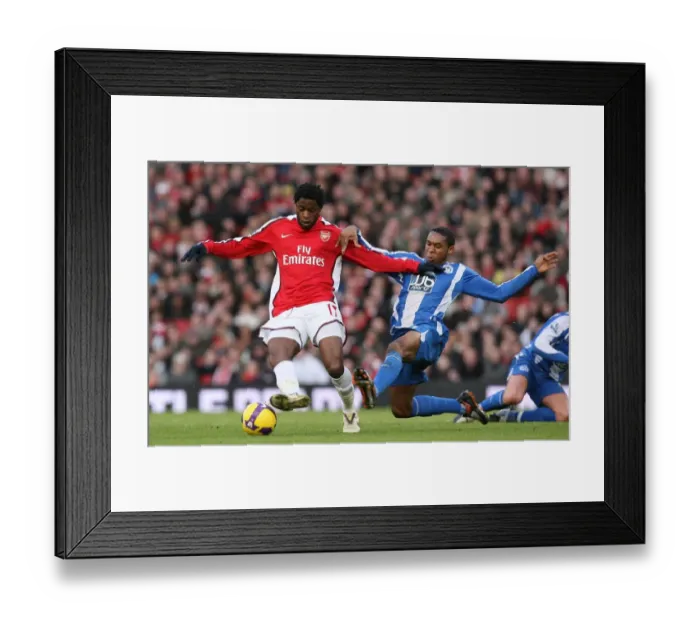Framed Print : Clash of the Midfielders: Song vs. Palacios in Arsenal's 1-0 Win over Wigan, 2008