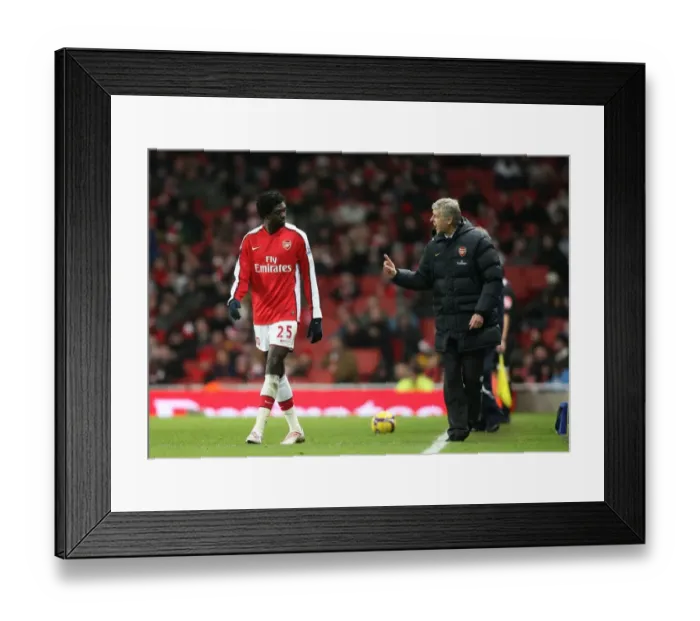 Framed Print : Arsenal manager Arsene Wenger talks with Emmanuel Adebayor