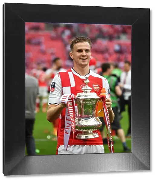 Rob Holding Lifts the FA Cup: Arsenal's Triumph over Chelsea