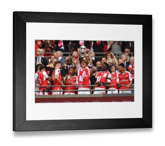 Framed Print : Granit Xhaka Lifts FA Cup Trophy: Arsenal's Victory over Chelsea (2017)