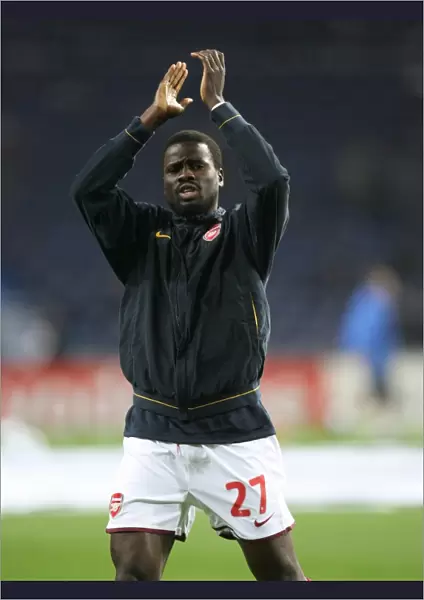 Arsenal defender Emmanuel Eboue waves to the fans before the match