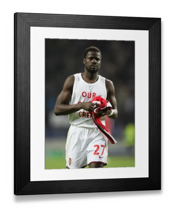 Framed Print : Arsenal defender Emmanuel Eboue throws his shirt to Framed Print : Arsenal defender Emmanuel Eboue throws his shirt to