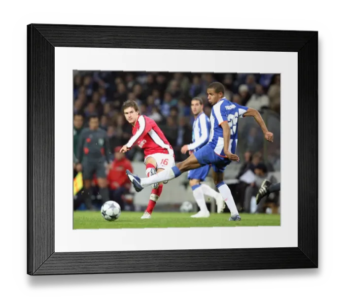 Framed Print : Aaron Ramsey (Arsenal) Fernando (FC Porto) Framed Print : Aaron Ramsey (Arsenal) Fernando (FC Porto)
