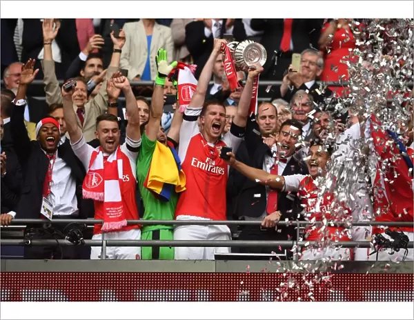 Arsenal's Per Mertesacker Lifts FA Cup after Arsenal v Chelsea Final Victory