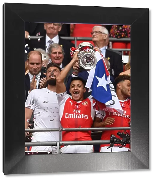 Alexis Sanchez (Arsenal) lifts the FA Cup