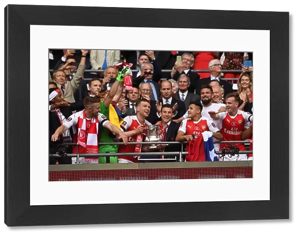 Arsenal FA Cup Victory: Per Mertesacker and Laurent Koscielny Celebrate with the Trophy after Beating Chelsea 2-1