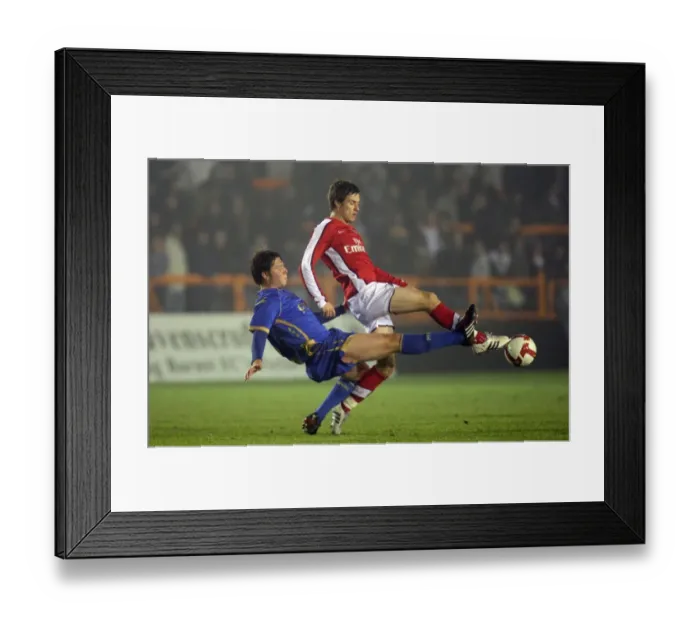 Framed Print : Arsenal's Aaron Ramsey Scores Twice Against Portsmouth's Callum Reynolds in Reserves Clash Framed Print : Arsenal's Aaron Ramsey Scores Twice Against Portsmouth's Callum Reynolds in Reserves Clash