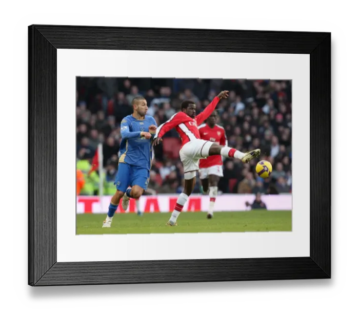 Framed Print : Emmanuel Eboue (Arsenal) Nadir Belhadj (Portsmouth) Framed Print : Emmanuel Eboue (Arsenal) Nadir Belhadj (Portsmouth)