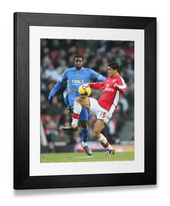 Framed Print : Denilson vs. Mvuemba: Arsenal's Edge over Portsmouth in the Premier League Showdown at Emirates Stadium (December 28, 2008)