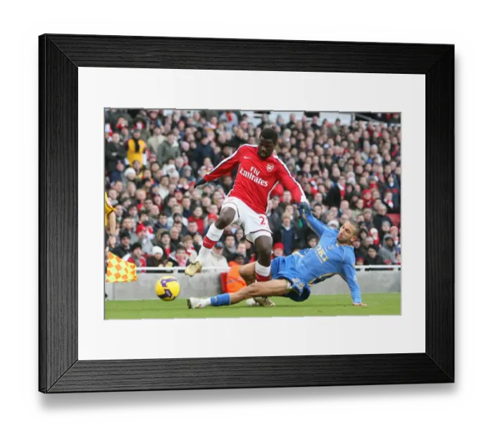 Framed Print : Clash of Stars: Eboue vs. Belhadj in Arsenal's 1-0 Victory over Portsmouth, 2008