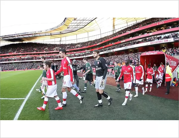 Arsenal captain Robin van Persie leads out the team