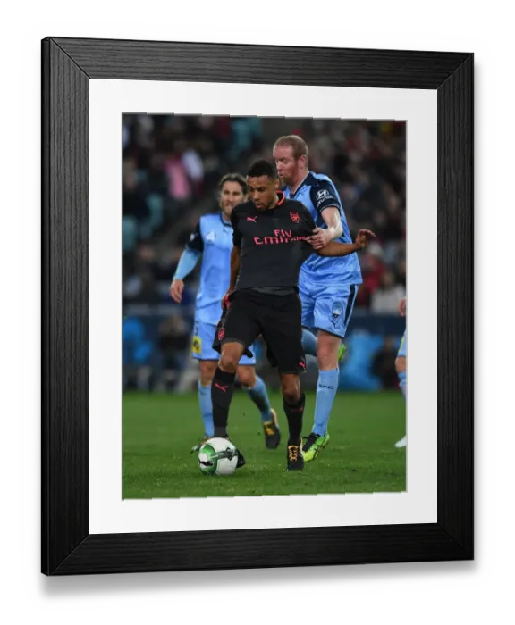 Framed Print : Arsenal's Francis Coquelin Clashes with Sydney FC's David Carney in Pre-Season Friendly
